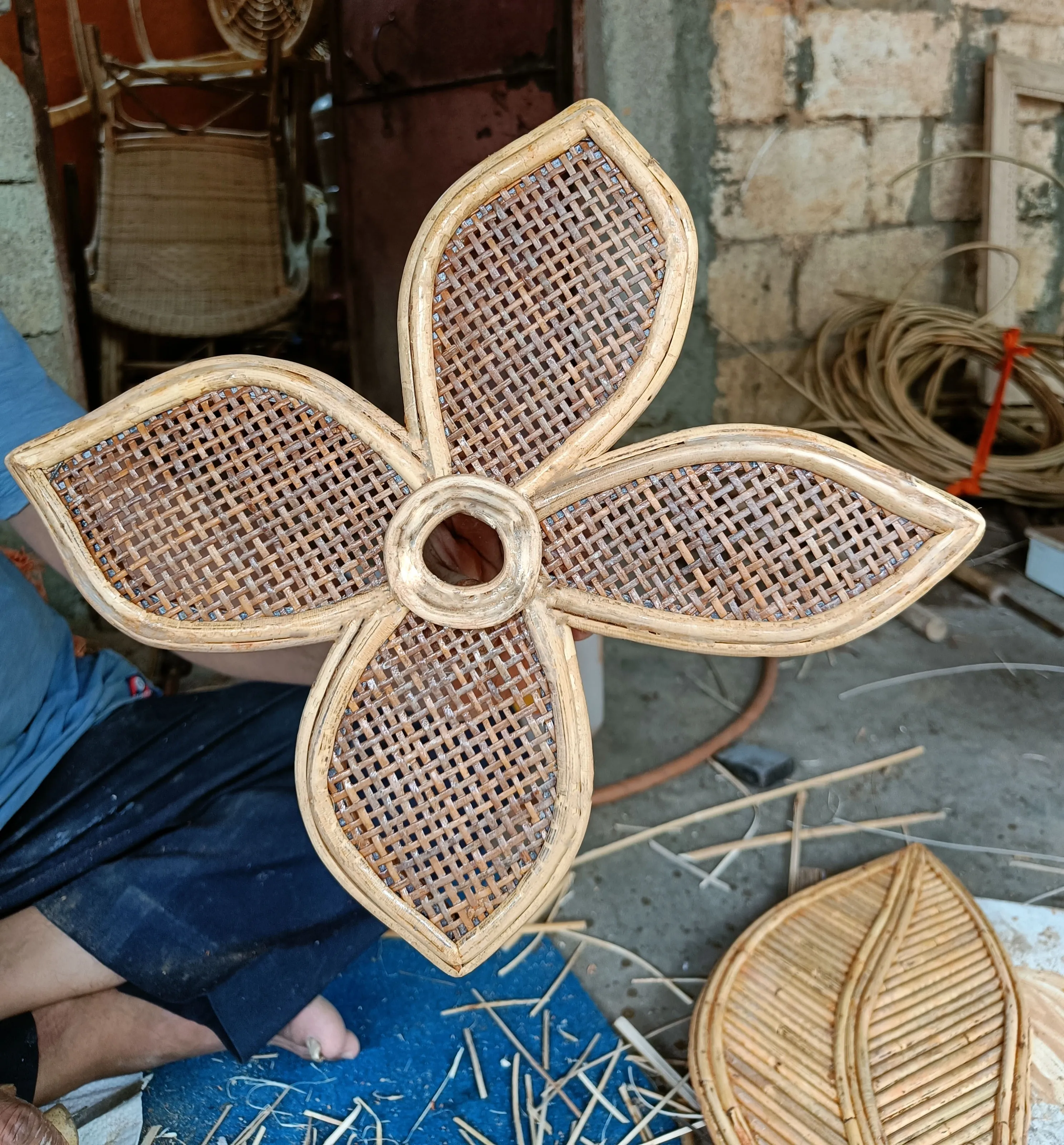 Artisan-woven cane coffee-flower component in progress, Malappuram